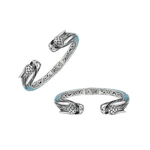 Wholesale sterling silver phoenix bangle featuring Turquoise Shell accents, ornate Balinese scroll engravings, and a secure hinge lock crafted for premium artisan wholesale jewelry collections.