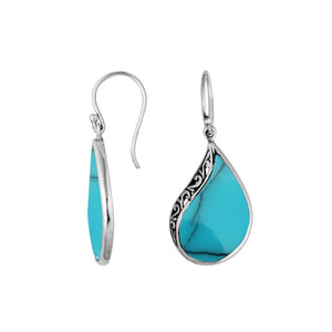 Wholesale sterling silver teardrop earrings with vibrant turquoise inlay and Balinese scroll detailing, handcrafted in Bali