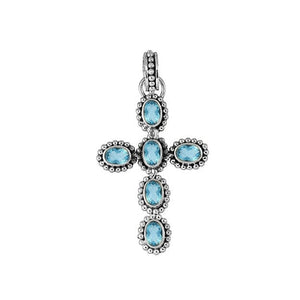 Sterling silver cross pendant with oval faceted blue topaz quartz and beaded detailing, handcrafted in Bali