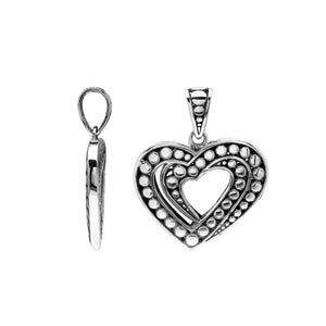Sterling silver heart-shaped pendant featuring layered open-heart design, dotted Balinese pattern, and oxidized polished finish.