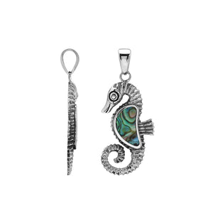 Sterling silver seahorse-shaped pendant with polished Abalone Shell inlay and intricate Balinese craftsmanship.