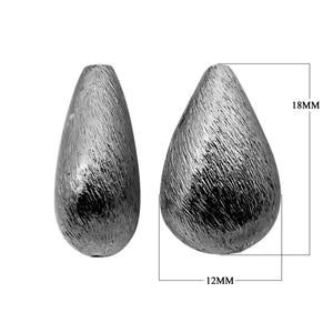 Black rhodium overlay over copper textured teardrop bead handcrafted in India for wholesale jewelry making