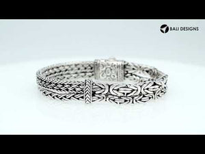 A wholesale sterling silver bracelet featuring a slim woven Balinese texture, polished finishing, smooth pattern, and secure push clasp suitable for premium bulk jewelry orders.