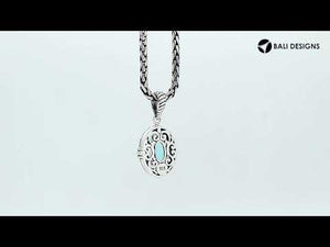 Sterling silver oval pendant with faceted Blue Topaz Quartz and rope-accent Balinese detail.