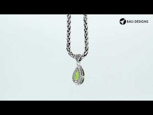 Sterling silver pear-shaped pendant featuring a faceted Peridot Quartz centerpiece with polished prong-setting and detailed Balinese carved ornamental accents.
