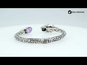 Sterling silver dragon head cuff bangle with black onyx ends and floral carvings handcrafted in Bali.