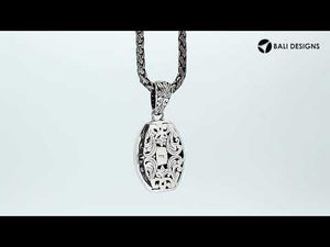 Sterling silver barrel-shaped pendant with Balinese scrollwork, wholesale artisan jewelry.