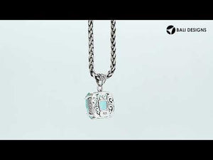 Sterling silver cushion pendant featuring a faceted Blue Topaz Quartz centerpiece secured by artistic prong detailing with traditional Balinese carved accents.