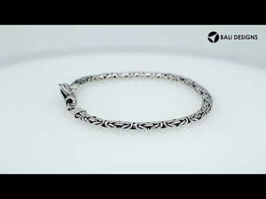 Wholesale sterling silver bracelet featuring a 3MM x 5MM Balinese woven chain with polished and oxidized detailing, finished with a secure lobster lock for catalog presentation.