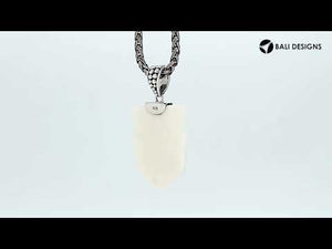 Wholesale sterling silver carved bone face pendant with ornate detailing.