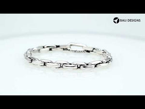 A wholesale sterling silver solid-link bracelet featuring a polished finish and durable Carabiner Lock, crafted with clean contemporary styling for premium bulk jewelry collections.