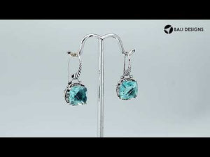 Wholesale sterling silver cushion-shaped earrings with Blue Topaz Quartz and Cubic Zirconia accents.