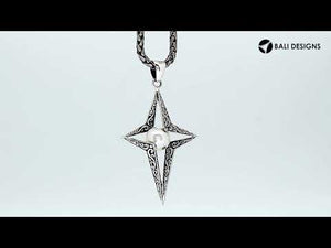 Sterling silver pendant featuring a four-point star design with White Pearl center and detailed filigree craftsmanship.