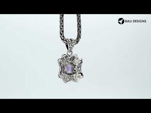Handcrafted sterling silver rectangular pendant with Amethyst Quartz center and traditional Balinese motif design.