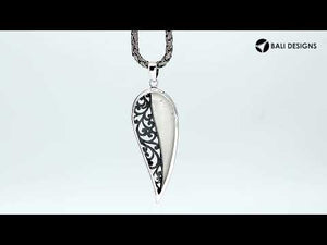 925 sterling silver long leaf pendant with mother of pearl and intricate Balinese scrollwork pattern