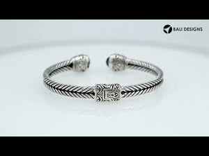 Sterling silver wholesale bangle with twisted rope design, Green Quartz end caps, and Balinese handcrafted details.