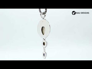 Sterling Silver Fresh Water Pearl Amethyst Quartz Bone Pendant With Textured Sunburst Frame.