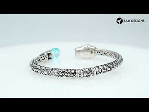 Sterling silver panther head cuff bangle with amethyst quartz ends and floral carvings handcrafted in Bali.