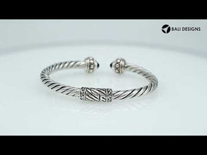 Sterling silver twisted rope bangle with green quartz ends, handcrafted in Bali.