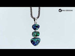 Sterling silver triple-shape pendant featuring turquoise shell stones with mirror-polished finish and detailed Balinese craftsmanship.