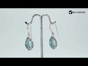 Wholesale Sterling Silver Blue Topaz Quartz Teardrop Earrings With Detailed Balinese-Style Metalwork.