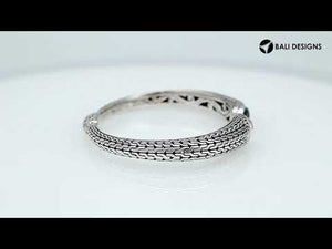 Wholesale sterling silver Bali engraved hinge cuff bracelet featuring bright blue topaz quartz accents with polished–oxidized artistry, crafted for premium wholesale jewelry inventory needs.