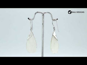 Wholesale sterling silver earrings with Mother Of Pearl teardrops and a polished tapered silver cap.