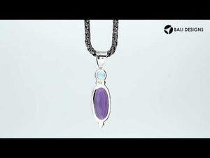 Sterling Silver Pendant With Amethyst Quartz And Blue Topaz Quartz In Oval Artisan Design.
