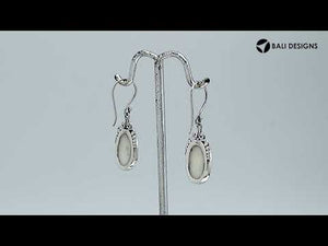 Sterling silver mother of pearl oval earrings with scroll and bead accent design for wholesale jewelry buyers