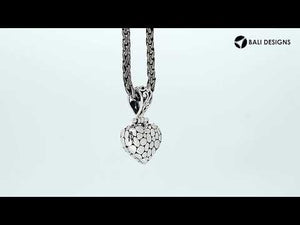 Wholesale sterling silver heart-shaped pendant with textured surface and ornate Balinese-style bail, handcrafted artisan jewelry from Bali.