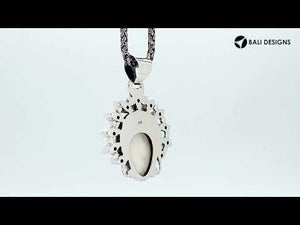 Sterling Silver Blue Topaz Quartz Garnet Quartz Bone Face Pendant With Ornate Balinese Headdress.