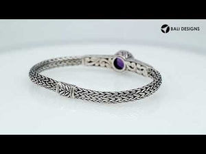 Wholesale sterling silver woven chain bracelet featuring a vivid Amethyst Quartz centerpiece, Balinese textured engravings, and a secure push clasp for premium gemstone jewelry assortments.