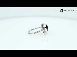 Sterling silver ring with a round Citrine Quartz and rope-style band design.