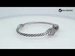 Sterling silver twisted bangle with Balinese carved ends, handcrafted in Bali