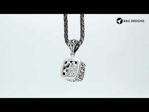 Sterling silver pendant with cushion-cut green amethyst quartz, handcrafted in Bali with bead and scroll detailing.