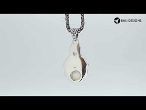 Wholesale bone face pendant with blue topaz quartz in sterling silver, handcrafted in Bali.