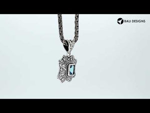 Sterling silver rectangular pendant with Blue Topaz Quartz and handcrafted Balinese filigree design.