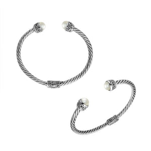 Wholesale sterling silver Pearl bangle with twisted rope design, oxidized finish, and Balinese motifs, handcrafted in Bali.