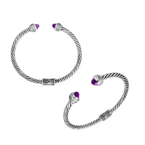 Sterling silver wholesale bangle with twisted rope design, featuring Amethyst Quartz and Cubic Zirconia end caps with Balinese motifs.