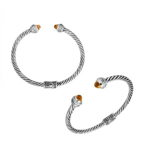 Sterling silver wholesale bangle with twisted rope design, accented by Citrine Quartz and Cubic Zirconia with Balinese motifs.
