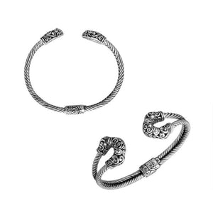 Sterling silver twisted bangle with cubic zirconia ends and Balinese carvings, handcrafted in Bali