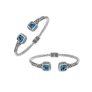 Sterling silver braided bangle with blue topaz quartz ends and Balinese oxidized design