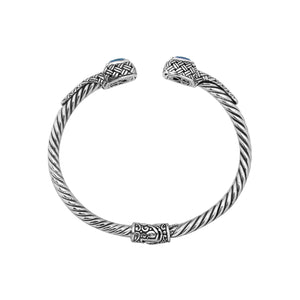 Sterling silver braided bangle with blue topaz quartz ends and Balinese oxidized design