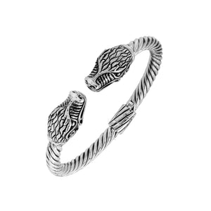 Sterling silver twisted bangle with dragon face design and oxidized Balinese pattern