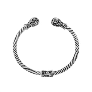 Sterling silver twisted bangle with ornate Balinese end design and oxidized finish