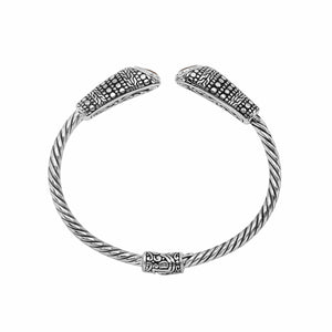 Sterling silver twisted bangle with garnet quartz ends and Balinese oxidized dot pattern