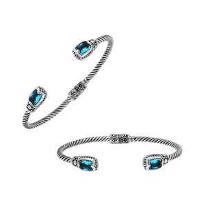 Silver twisted cable bangle in 925 sterling silver with Blue Topaz Quartz and ornate Balinese engraving.
