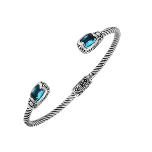 Silver twisted cable bangle in 925 sterling silver with Blue Topaz Quartz and ornate Balinese engraving.