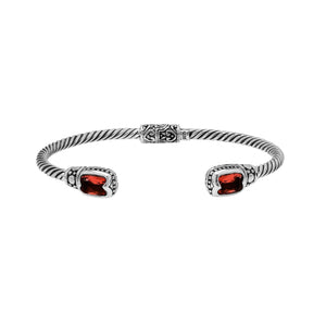 Silver twisted cable bangle in 925 sterling silver with Garnet Quartz ends and Balinese engraving.