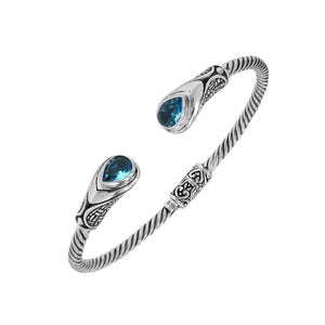Silver twisted cable bangle in 925 sterling silver with Blue Topaz Quartz and Balinese engraving.
